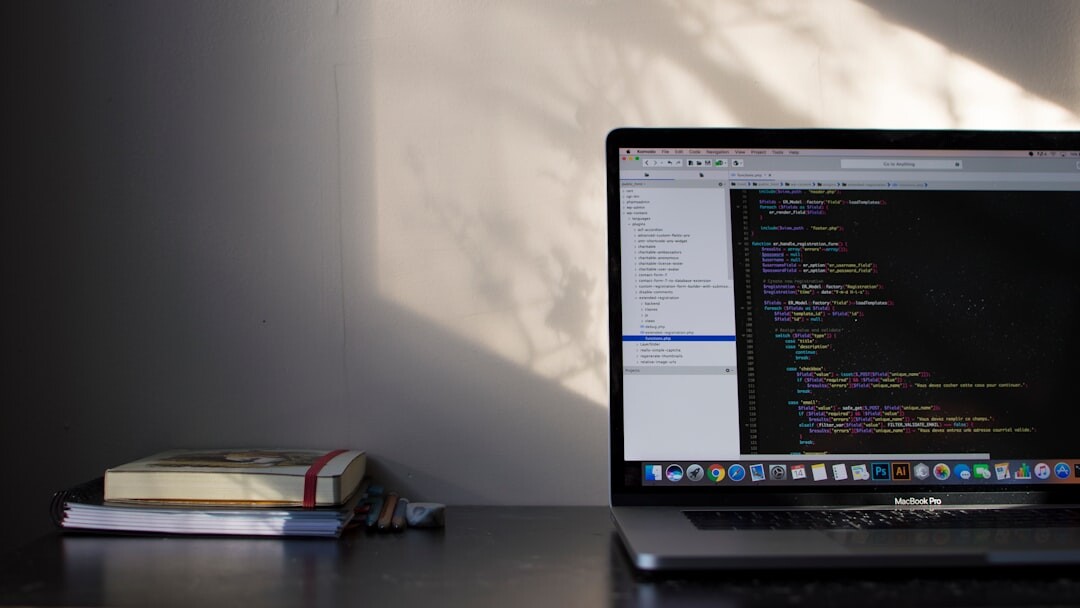 Software developer coding on multiple screens